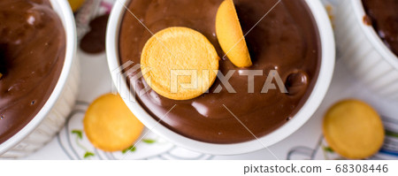 white ceramic bowl with chocolate pudding white ceramic bowl with chocolate pudding 68308446
