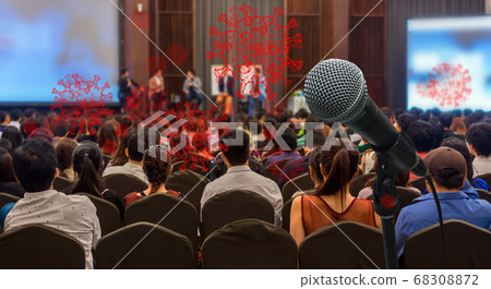 Coronavirus Network Outbreak over Rear view of Audience listening Speakers on the stage in the conference hall or seminar meeting, business and education take risk for covid19, social distance concept Coronavirus Network Outbreak over Rear view of Audience listening Speakers on the stage in the conference hall or seminar meeting, business and education take risk for covid19, social distance concept 68308872
