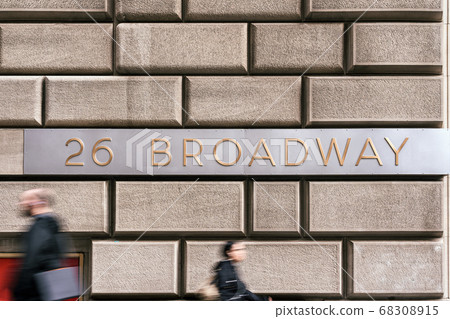 Broadway Street "26 BROADWAY" sign and wall street over vintage wall beside the street, Broadway is a road in the U.S. state of New York, Business and sing of landmark concept Broadway Street "26 BROADWAY" sign and wall street over vintage wall beside the street, Broadway is a road in the U.S. state of New York, Business and sing of landmark concept 68308915