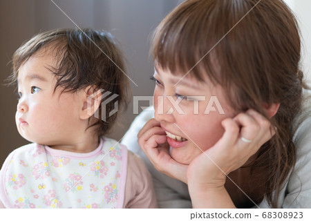 Mother cuddling with baby Mother cuddling with baby 68308923