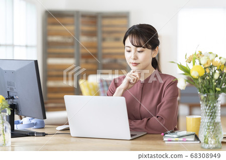 Young woman working at home Young woman working at home 68308949