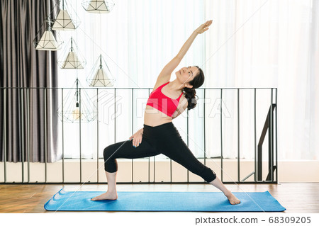 Asian woman practicing yoga from home when Covid19 outbreak and lockdown, healthy or Meditation Exercise, yoga workout at home, coronavirus pandemic and quarantine, sports and healthcare concept Asian woman practicing yoga from home when Covid19 outbreak and lockdown, healthy or Meditation Exercise, yoga workout at home, coronavirus pandemic and quarantine, sports and healthcare concept 68309205