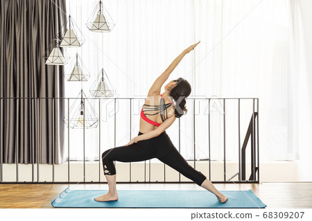Asian woman practicing yoga from home when Covid19 outbreak and lockdown, healthy or Meditation Exercise, yoga workout at home, coronavirus pandemic and quarantine, sports and healthcare concept Asian woman practicing yoga from home when Covid19 outbreak and lockdown, healthy or Meditation Exercise, yoga workout at home, coronavirus pandemic and quarantine, sports and healthcare concept 68309207
