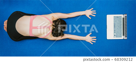 Banner Asian woman practicing yoga from home with laptop when Covid19 outbreak, healthy or Meditation Exercise, workout at home, coronavirus pandemic and quarantine, sports and healthcare in concept 68309212