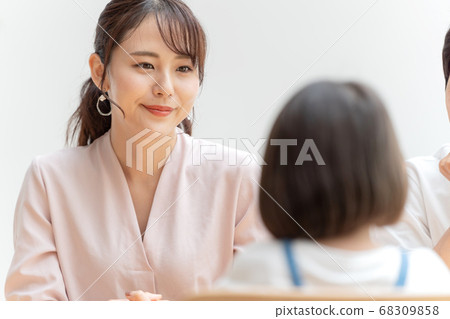 Parent and child having a family meeting in the living room Parent and child having a family meeting in the living room 68309858