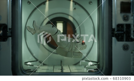 astronaut inside the orbital space station 68310903