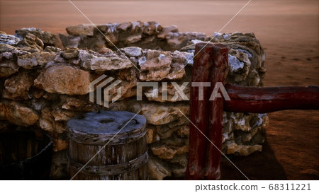 old stone water well in the desert old stone water well in the desert 68311221