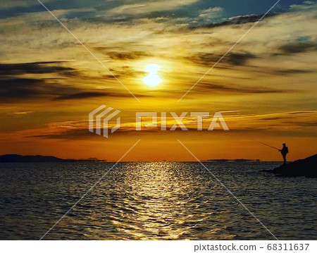 A person fishing quietly in the beautiful morning sun on the Chigasaki coast in early winter [December] 68311637
