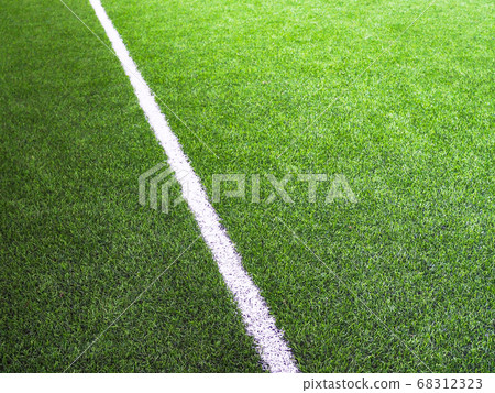 white line on green grass of futsal field or soccer field football 68312323