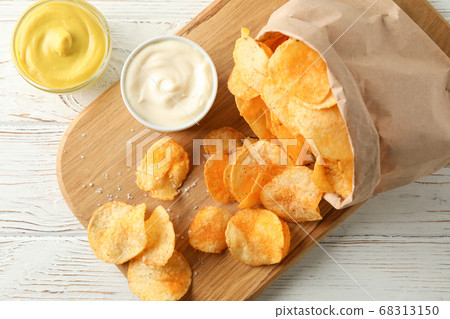 Paper bag of potato chips. Beer snacks, sauce on Paper bag of potato chips. Beer snacks, sauce on 68313150