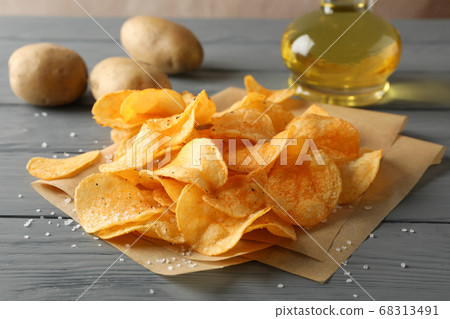 Potato chips on craft paper, sault, oliv oil, 68313491