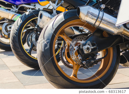 row of rear wheels of sports bikes in competition row of rear wheels of sports bikes in competition 68313617