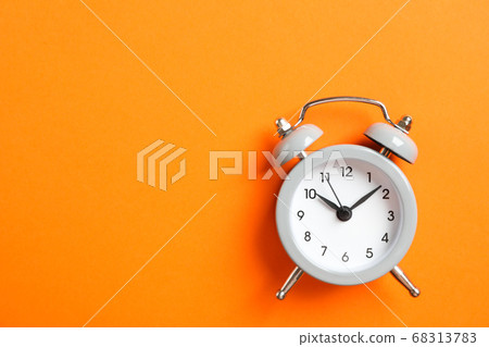 Retro alarm clock on color background, space for Retro alarm clock on color background, space for 68313783