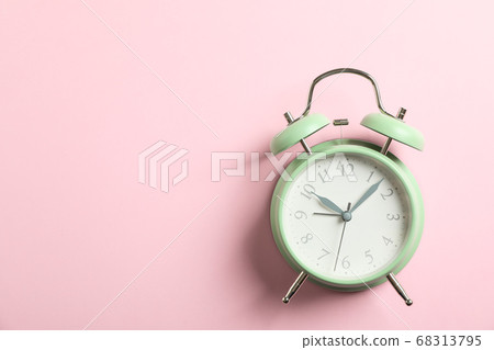 Retro alarm clock on color background, space for 68313795