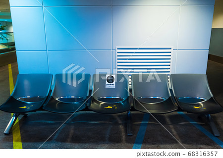 Empty international airport building during Empty international airport building during 68316357