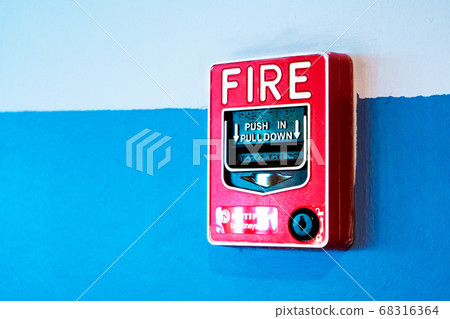 Red button handbrake fire alarm on the wall. Red button handbrake fire alarm on the wall. 68316364