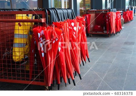 Baskets with umbrellas at the exit from the 68316378