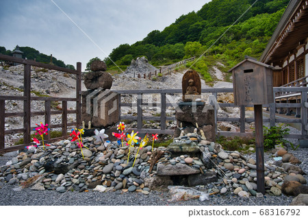 Buddhist statues and windmills of Osorezan, one of Japan's three major sacred sites, in Shimokita Peninsula, Aomori Prefecture Buddhist statues and windmills of Osorezan, one of Japan's three major sacred sites, in Shimokita Peninsula, Aomori Prefecture 68316792