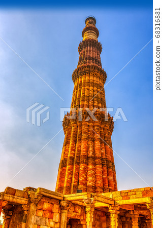 Qutb Minar tower seen through the ruined mosque at Qutub Minar complex in New Delhi, India 68316881