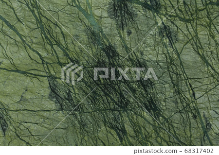 Dark natural green marble texture close-up. Dark natural green marble texture close-up. 68317402