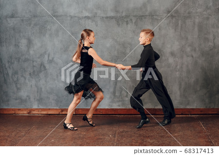 Young couple boy and girl dancing in ballroom dance Jive 68317413