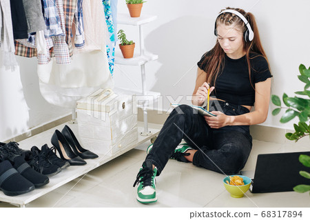 Teenage girl writing poetry Teenage girl writing poetry 68317894