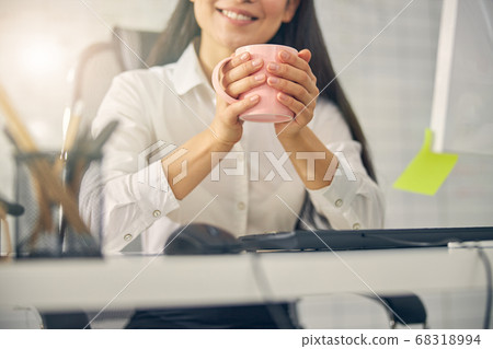 Joyful young woman demonstrating her friendly smile 68318994