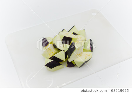 Sliced eggplant on a white cutting board 68319635