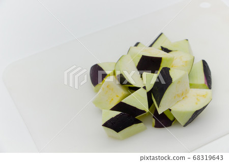 Sliced eggplant on a white cutting board 68319643