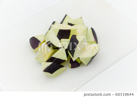 Sliced eggplant on a white cutting board 68319644