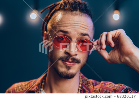 Stylish guy with dreadlocks wearing pink sunglasses 68320117