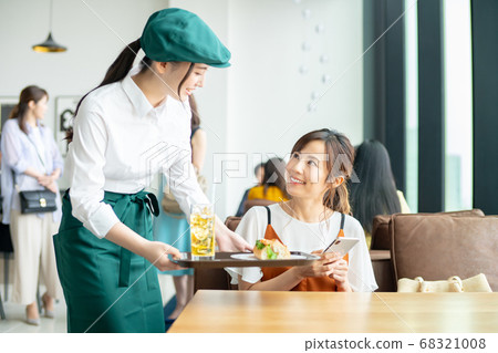 Cafe clerk and young woman Cafe clerk and young woman 68321008