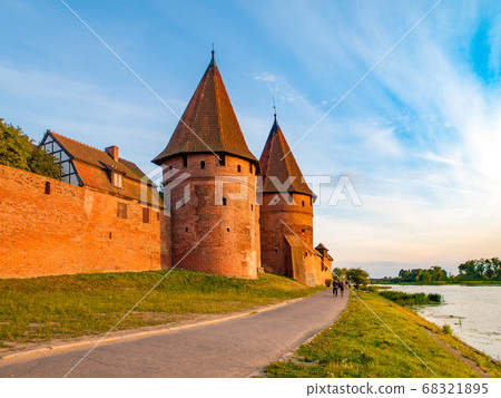 Fortification walls and guard towers of Teutonic Castle in Malbork, Poland 68321895