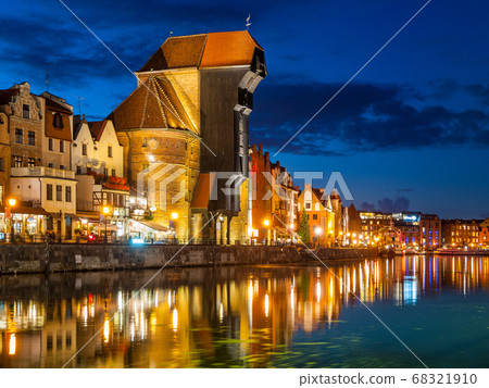 Gdansk Old Town and famous crane on River Motlawa embankment by night, Poland Gdansk Old Town and famous crane on River Motlawa embankment by night, Poland 68321910
