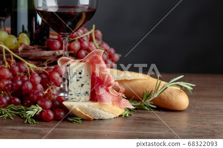 Delicious snack and glasses of red wine. Delicious snack and glasses of red wine. 68322093