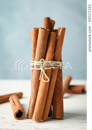 Cinnamon sticks on white wooden background, space Cinnamon sticks on white wooden background, space 68323162