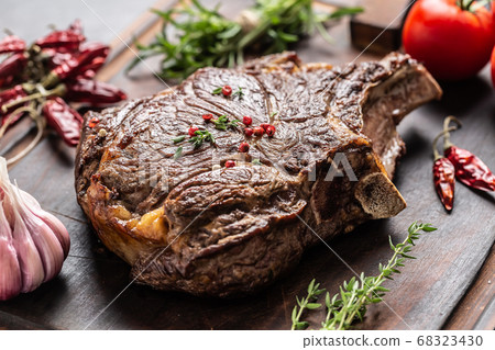 Grilled beef steak with spices herbs salt pepper 68323430