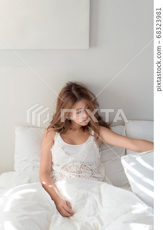 Beautiful Asian woman home in bed relax happy 68323981