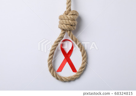 Awareness red ribbon and suicide rope on white 68324815