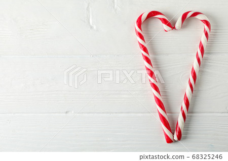 Sweet candy canes on white wooden background, Sweet candy canes on white wooden background, 68325246