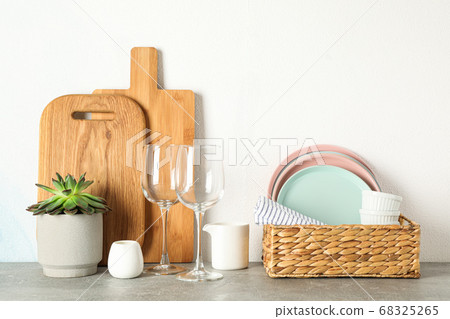Set of dinnerware with succulent plant on grey Set of dinnerware with succulent plant on grey 68325265