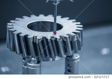 The CMM machine measuring the metal bevel gear. 68325727