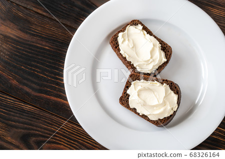 Slices of rye bread with cream cheese Slices of rye bread with cream cheese 68326164