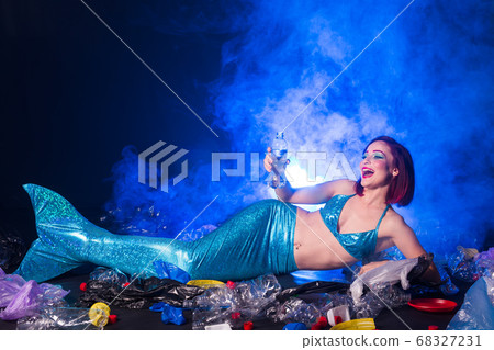 Ocean plastic pollution concept. Mermaid lives to polluted habitat. 68327231
