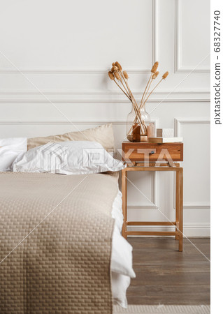 Cozy details in white contemporary bedroom interior with gypsum stucco on white walls 68327740