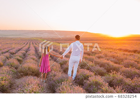 Family of two in lavender flowers field Family of two in lavender flowers field 68328254