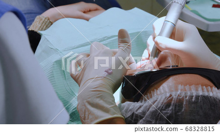 Young woman at dental clinic Young woman at dental clinic 68328815