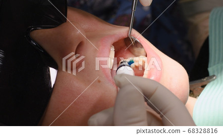 Young woman at dental clinic Young woman at dental clinic 68328816