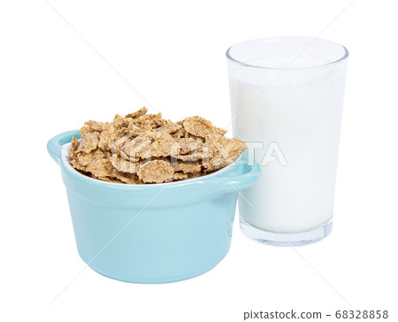 Bowl of cereals corn with a glass of milk isolated on white background.  68328858