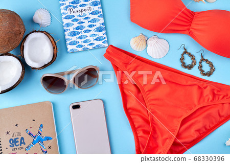 Female sunglasses with swimwear and other beach resort accessories. Female sunglasses with swimwear and other beach resort accessories. 68330396
